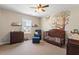 bedroom with mural, crib, chair and shelves at 3007 Cardinal Lake Dr, Durham, NC 27704