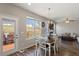 Dining area featuring a wood table and chairs, a large window, and a sliding door at 3007 Cardinal Lake Dr, Durham, NC 27704