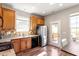 Cozy kitchen with stainless steel refrigerator and sliding door to outdoor deck at 3007 Cardinal Lake Dr, Durham, NC 27704