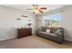 Cozy living room featuring a sofa, dresser, and window with natural light at 3007 Cardinal Lake Dr, Durham, NC 27704