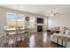 Bright living room featuring a fireplace, hardwood floors, and lots of natural light at 3007 Cardinal Lake Dr, Durham, NC 27704