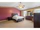 Spacious main bedroom with a large bed, dresser, and natural light at 3007 Cardinal Lake Dr, Durham, NC 27704