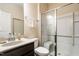 Modern bathroom with a glass enclosed shower and neutral color palette at 303 Fortress Dr, Morrisville, NC 27560