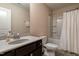 Well lit bathroom with a vanity, a bath tub, and a walk in shower at 303 Fortress Dr, Morrisville, NC 27560