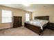 Comfortable bedroom featuring a wooden dresser and a bright window at 303 Fortress Dr, Morrisville, NC 27560