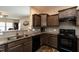 Modern kitchen featuring granite countertops, and stainless steel appliances at 303 Fortress Dr, Morrisville, NC 27560