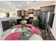 Modern kitchen with stainless steel appliances, granite countertops, and a breakfast nook at 303 Fortress Dr, Morrisville, NC 27560