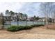 Well-maintained community tennis courts enclosed by a black fence; a great amenity for active residents at 303 Fortress Dr, Morrisville, NC 27560