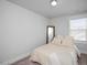 Bedroom features neutral color palette, comfortable bedding, and ample natural light at 305 Wash Hollow Dr, Wendell, NC 27591