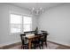 Elegant dining room featuring a modern chandelier and ample natural light at 305 Wash Hollow Dr, Wendell, NC 27591