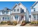 Charming two-story home with a welcoming front porch and well-manicured landscaping at 305 Wash Hollow Dr, Wendell, NC 27591
