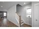 Beautiful foyer features hardwood floors, a stairway, and natural light at 305 Wash Hollow Dr, Wendell, NC 27591