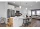 Open-concept kitchen with stainless steel appliances, quartz countertops, and a breakfast bar at 305 Wash Hollow Dr, Wendell, NC 27591