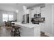 Spacious kitchen with stainless steel appliances, quartz countertops, and ample cabinet space at 305 Wash Hollow Dr, Wendell, NC 27591