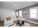 Inviting living room with a sectional sofa, natural light, and modern decor at 305 Wash Hollow Dr, Wendell, NC 27591