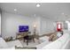 Bright living room with a cozy sectional sofa, entertainment center, and open layout at 305 Wash Hollow Dr, Wendell, NC 27591