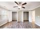 Bedroom featuring modern floors and an abundance of closet space and a window at 317 Michigan Ave, Cary, NC 27519