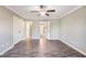 An empty bedroom with grey walls, modern flooring, and an open doorway to the rest of the house at 317 Michigan Ave, Cary, NC 27519