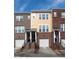 Charming townhome showcasing a brick facade, covered entrance, and attached garage, perfect for modern living at 317 Michigan Ave, Cary, NC 27519