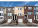Attractive townhome exterior featuring mixed brick and siding, individual entrances, and convenient garage access at 317 Michigan Ave, Cary, NC 27519
