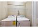 Laundry room with white washer and dryer at 317 Michigan Ave, Cary, NC 27519
