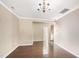 Bright and airy living room featuring hardwood floors, crown molding, and neutral paint colors at 317 Michigan Ave, Cary, NC 27519