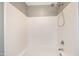 Shower/Tub combination featuring white tile and modern fixtures at 317 Michigan Ave, Cary, NC 27519