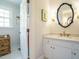 Elegant bathroom with a white vanity, marble countertop, and classic fixtures, exuding sophistication and style at 3321 Marblehead Ln, Raleigh, NC 27612