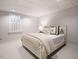 Cozy bedroom featuring natural light from the window and neutral decor for a serene atmosphere at 3321 Marblehead Ln, Raleigh, NC 27612