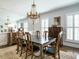 Elegant dining room features a chandelier, large mirror, and classic furnishings at 3321 Marblehead Ln, Raleigh, NC 27612