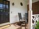 Cozy front porch with rocking chairs and brick flooring, offering a relaxing outdoor space at 3321 Marblehead Ln, Raleigh, NC 27612