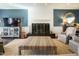 Elegant living room with a fireplace, stylish furnishings, and neutral tones, perfect for relaxation and entertaining at 3321 Marblehead Ln, Raleigh, NC 27612