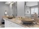 Bathroom boasts stone counter tops, dual vessel sinks and modern fixtures at 3424 Forest Oaks Dr, Chapel Hill, NC 27514
