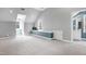 Bright bonus room with built-in window seats, neutral carpet and access to a full bath at 3424 Forest Oaks Dr, Chapel Hill, NC 27514