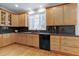 Bright kitchen features light wood cabinets, dark countertops and stainless steel appliances at 3424 Forest Oaks Dr, Chapel Hill, NC 27514