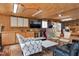 Open living area featuring wood ceiling, storage cabinets, modern TV, and contemporary furnishings at 3424 Forest Oaks Dr, Chapel Hill, NC 27514