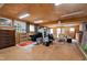 Spacious living area with multiple windows, wood ceiling, lots of storage, and flexible seating arrangements at 3424 Forest Oaks Dr, Chapel Hill, NC 27514