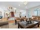 Open concept living space with hardwood flooring, staircase, and access to multiple rooms for seamless entertaining at 3424 Forest Oaks Dr, Chapel Hill, NC 27514