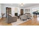 Living room showcasing a fireplace, hardwood floors, neutral colored furniture and natural light from the windows at 3424 Forest Oaks Dr, Chapel Hill, NC 27514