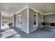 Relaxing porch with a wooden swing, neutral walls, and ample natural light at 3424 Forest Oaks Dr, Chapel Hill, NC 27514
