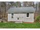 Exterior view of a well-maintained shed featuring a ramp and a window air conditioner at 3424 Forest Oaks Dr, Chapel Hill, NC 27514