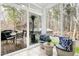 Sunroom features comfortable seating, tile floors and views of the back yard at 3424 Forest Oaks Dr, Chapel Hill, NC 27514
