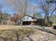 View of back of home with partial driveway and fencing at 3601 Colonial Ln, Rocky Mount, NC 27804