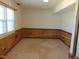 Finished basement featuring carpet flooring, wood trim walls, and a window offering natural light at 3601 Colonial Ln, Rocky Mount, NC 27804