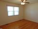 Bedroom featuring natural hardwood flooring, with a window and natural light at 3601 Colonial Ln, Rocky Mount, NC 27804