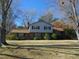 Charming two-story home featuring a brick facade and a well-maintained front yard at 3601 Colonial Ln, Rocky Mount, NC 27804