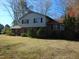 Well-maintained two story home with a large yard, showcasing a blend of brick and siding exterior at 3601 Colonial Ln, Rocky Mount, NC 27804