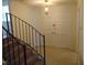 Bright foyer with stairway, coat closet, and tiled floors at 3601 Colonial Ln, Rocky Mount, NC 27804