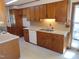 Traditional kitchen with wooden cabinetry, built in fridge, and classic appliances at 3601 Colonial Ln, Rocky Mount, NC 27804