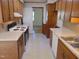 Traditional kitchen with wooden cabinetry and classic appliances at 3601 Colonial Ln, Rocky Mount, NC 27804